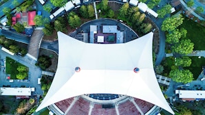 An aerial view of a stadium with a central seating area and a surrounding road. - Hotel Avante - JDV by Hyatt (Mountain View)