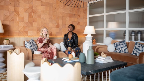 A modern living room with geometric patterned walls, a coffee table, and two sofas. - Hotel Avante - JDV by Hyatt (Mountain View)