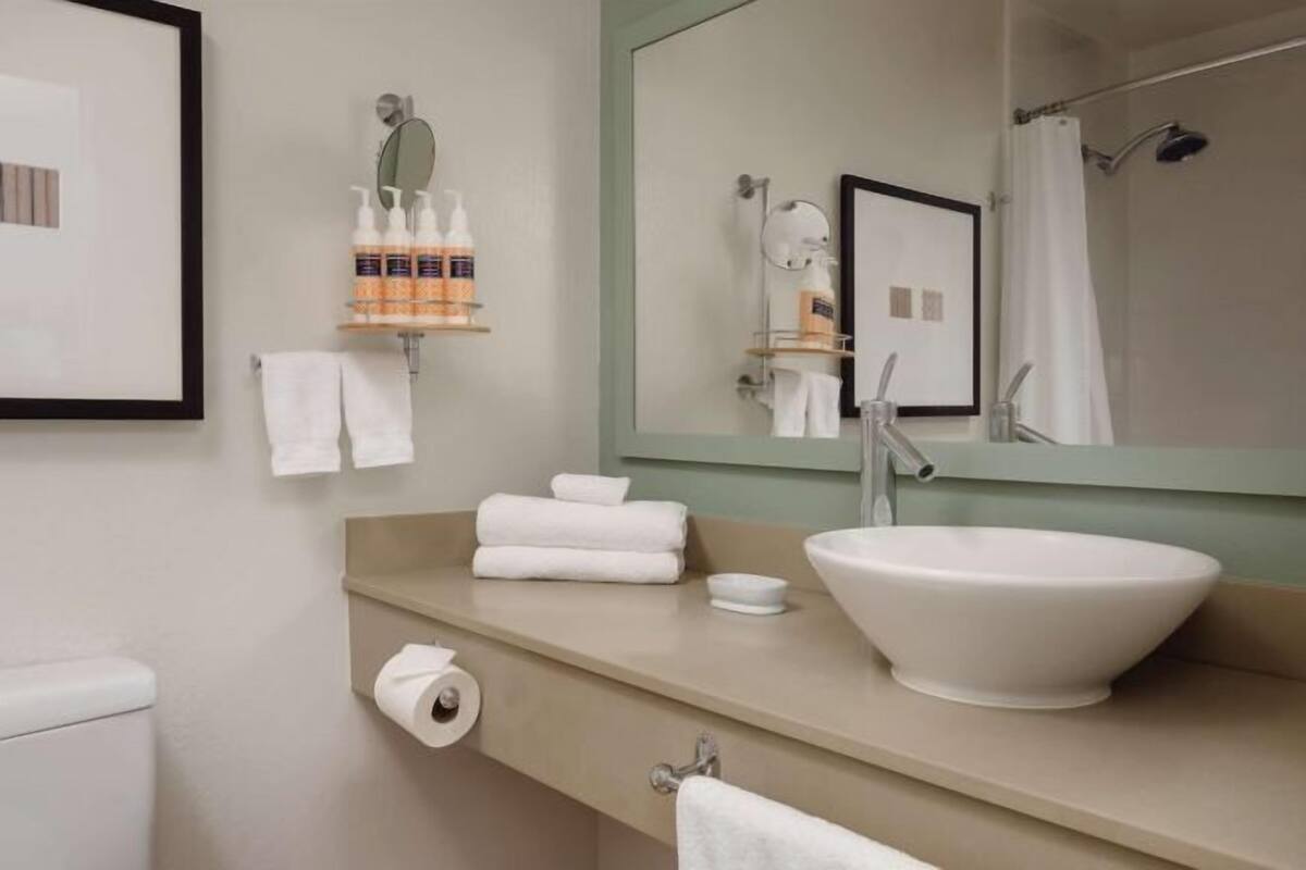 Combined shower/bathtub, designer toiletries, hair dryer, bathrobes