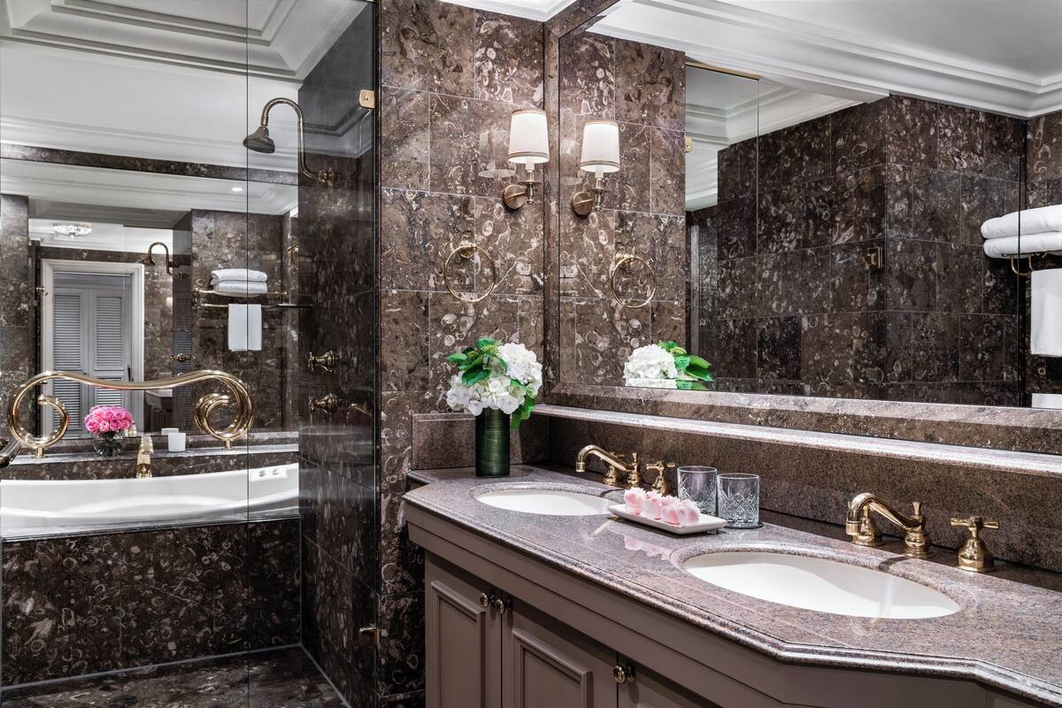 chairman suite | bathroom | designer toiletries, hair dryer, bathrobes, slippers