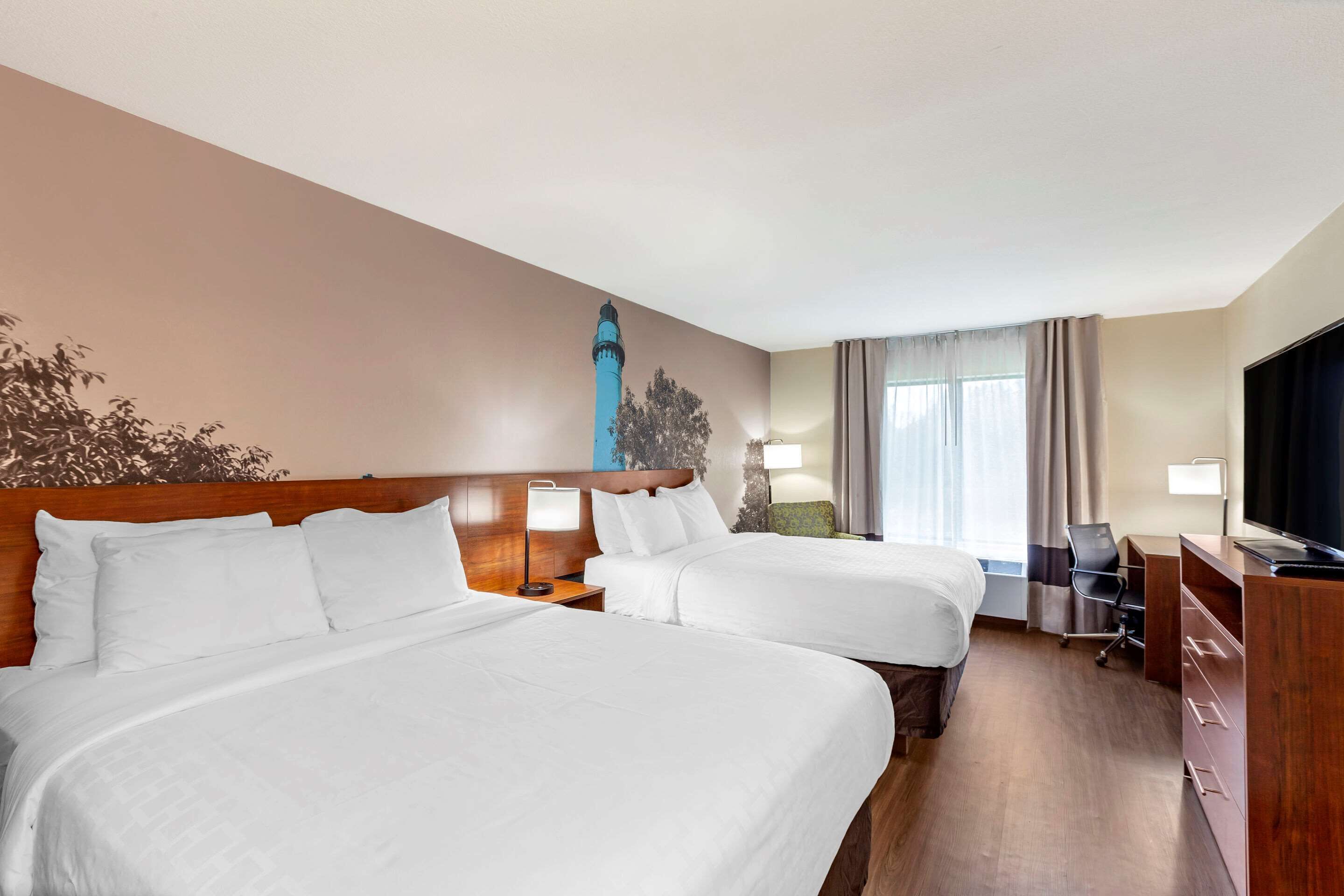 premium bedding, memory-foam beds, desk, blackout curtains