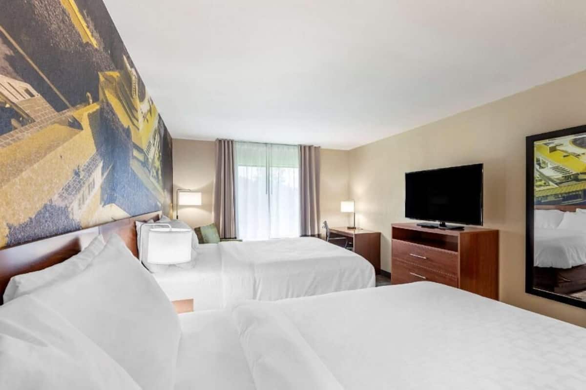 Premium bedding, memory foam beds, desk, blackout drapes