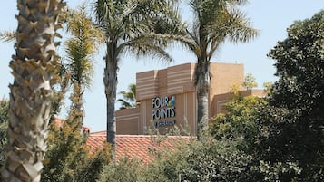 A building with a sign that reads 'FOUR POINTS BY SHERATON.'