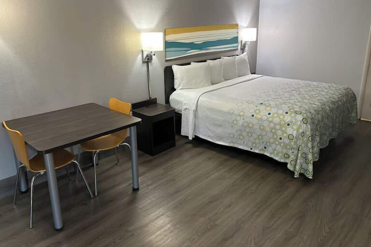 Premium bedding, desk, laptop workspace, blackout curtains