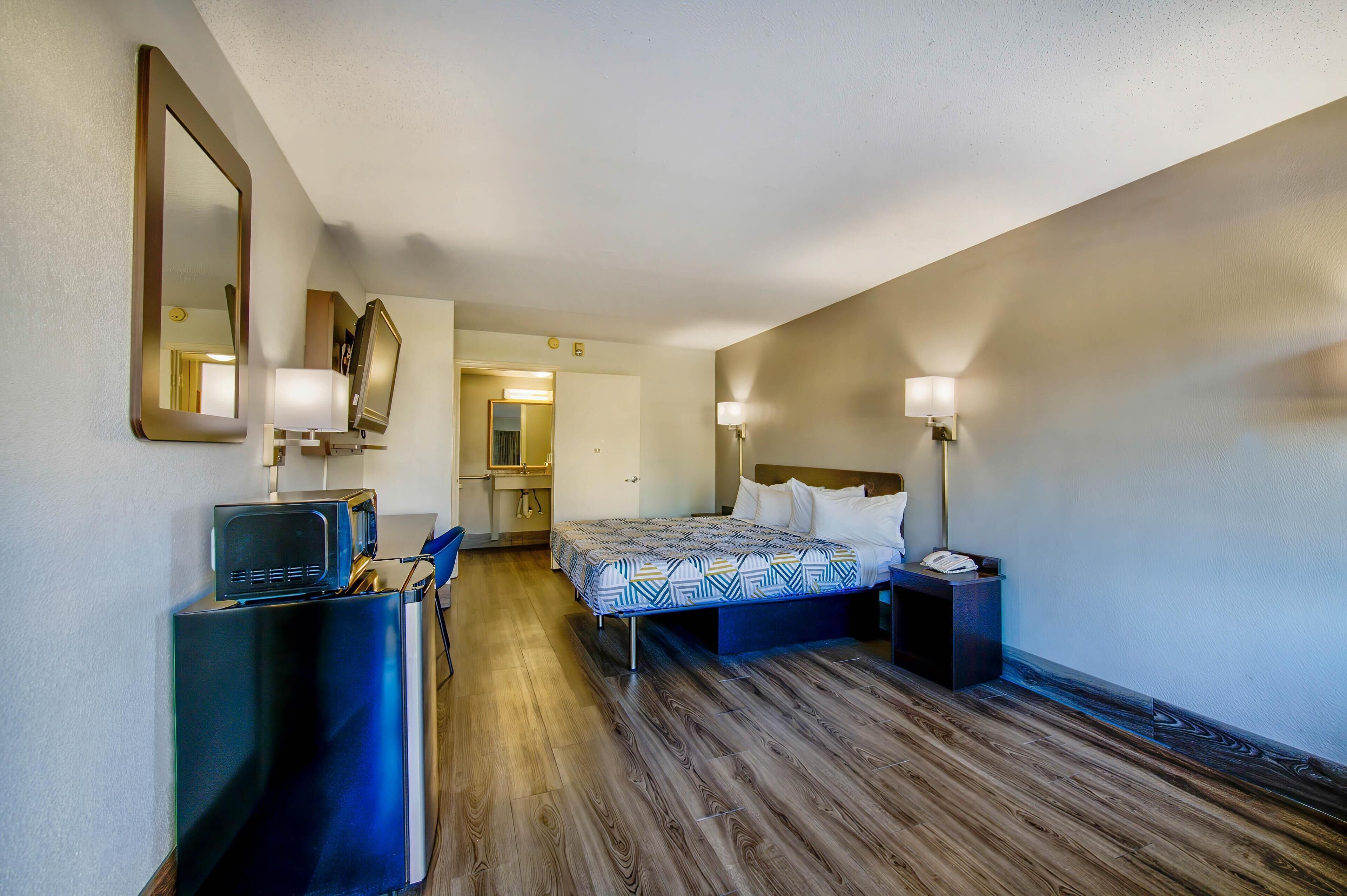 Premium bedding, desk, laptop workspace, rollaway beds