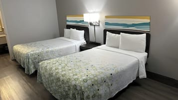 Premium bedding, desk, laptop workspace, blackout drapes
