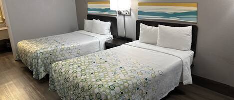Premium bedding, desk, laptop workspace, blackout drapes