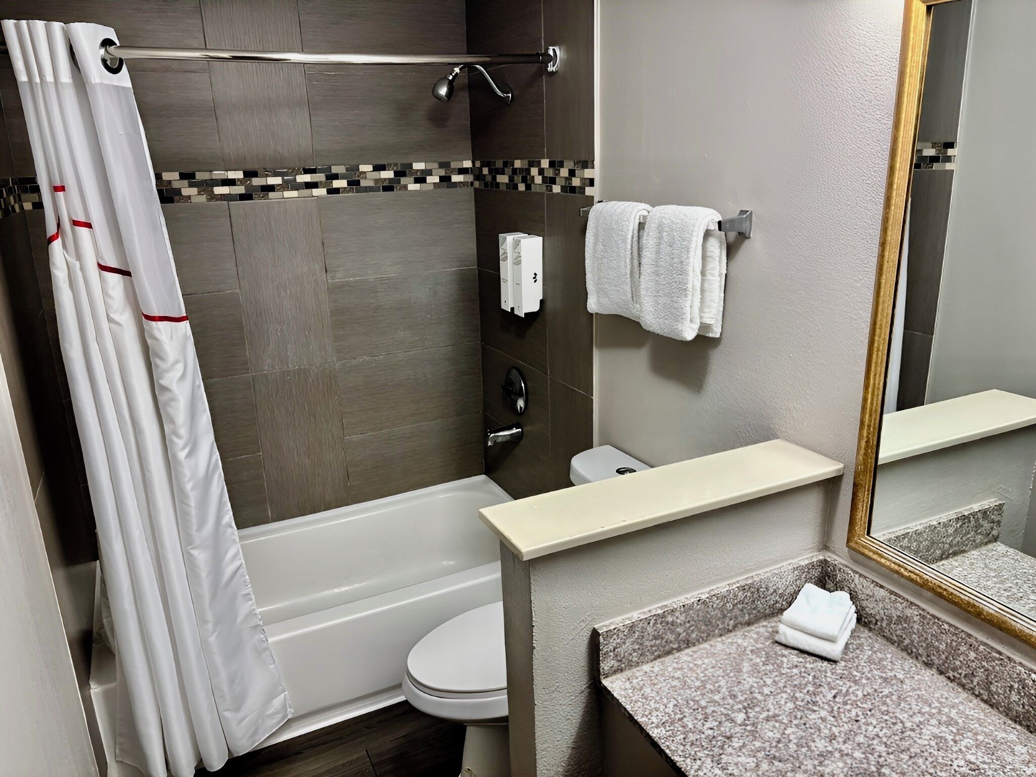 Combined shower/bathtub, hair dryer, towels, soap
