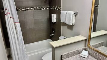 Combined shower/tub, hair dryer, towels, soap