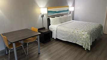 Premium bedding, desk, laptop workspace, blackout curtains