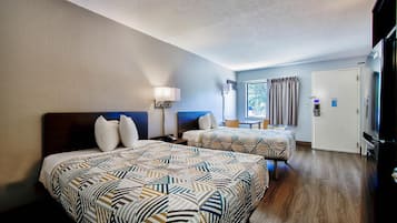 Premium bedding, desk, laptop workspace, rollaway beds