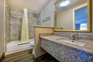 Combined shower/bathtub, towels, soap, toilet paper