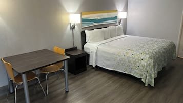 Premium bedding, desk, laptop workspace, blackout curtains