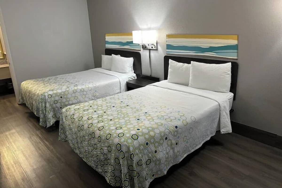 Premium bedding, desk, laptop workspace, blackout curtains