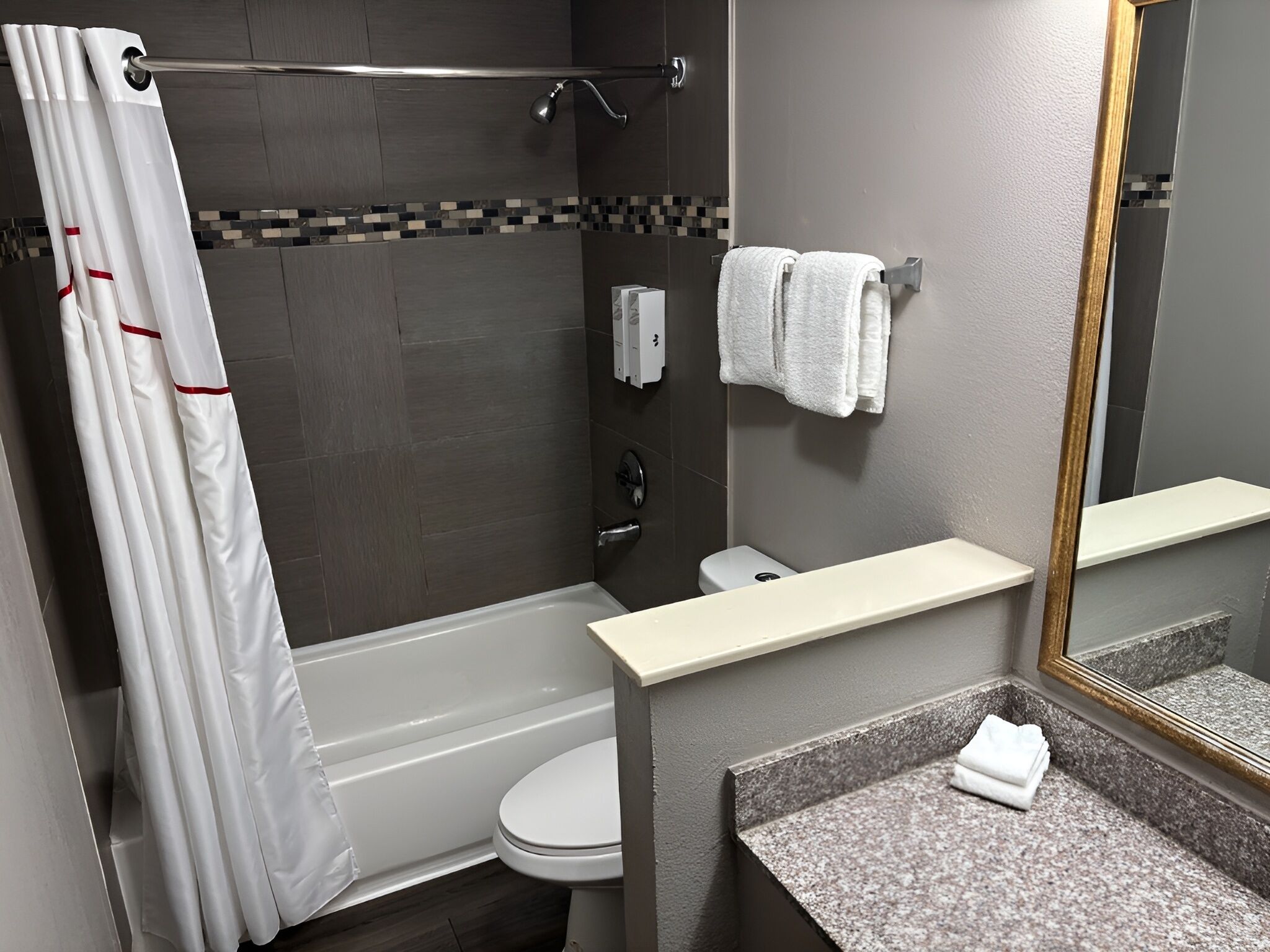 Combined shower/tub, hair dryer, towels, soap