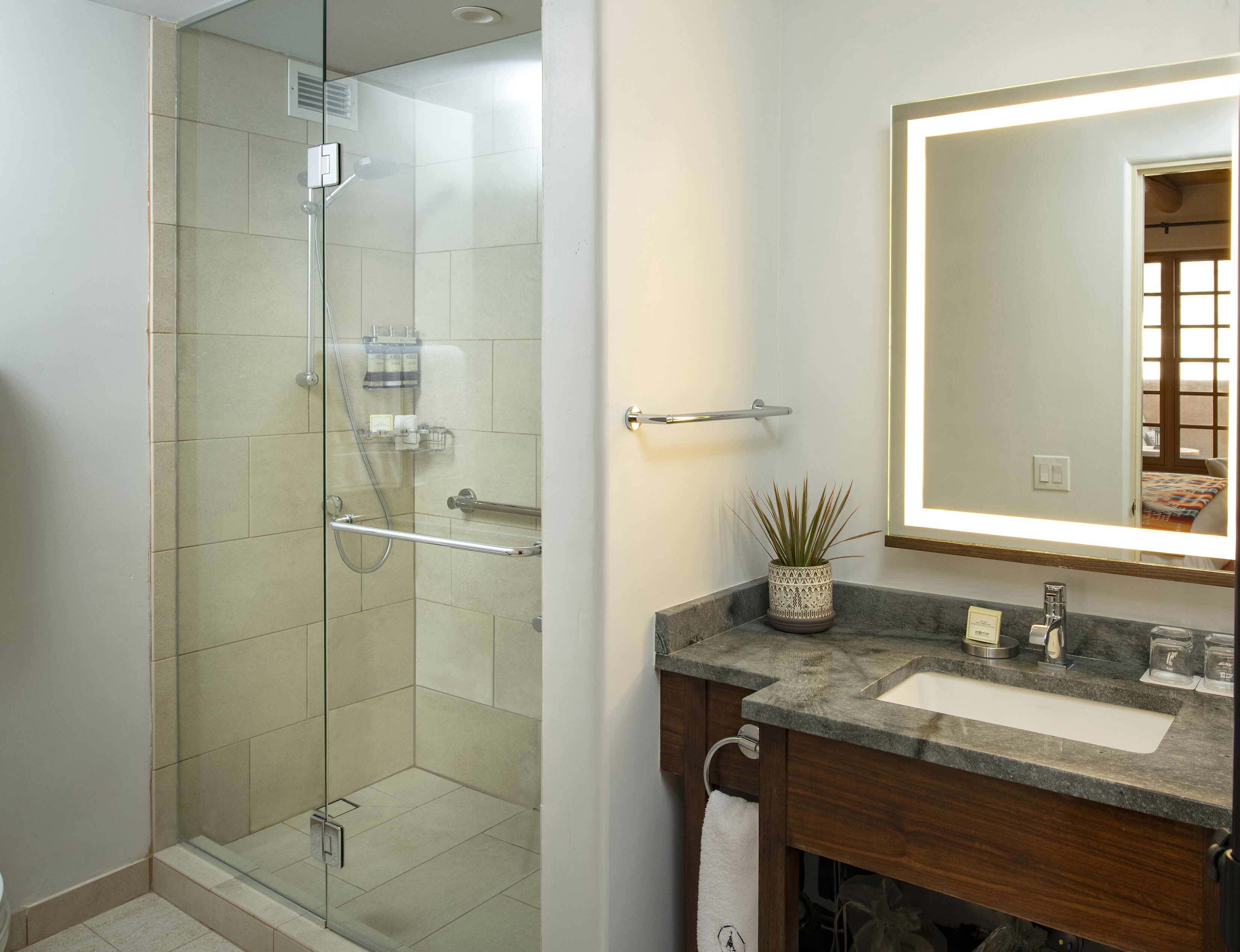 combined shower/bathtub, designer toiletries, hair dryer, bathrobes