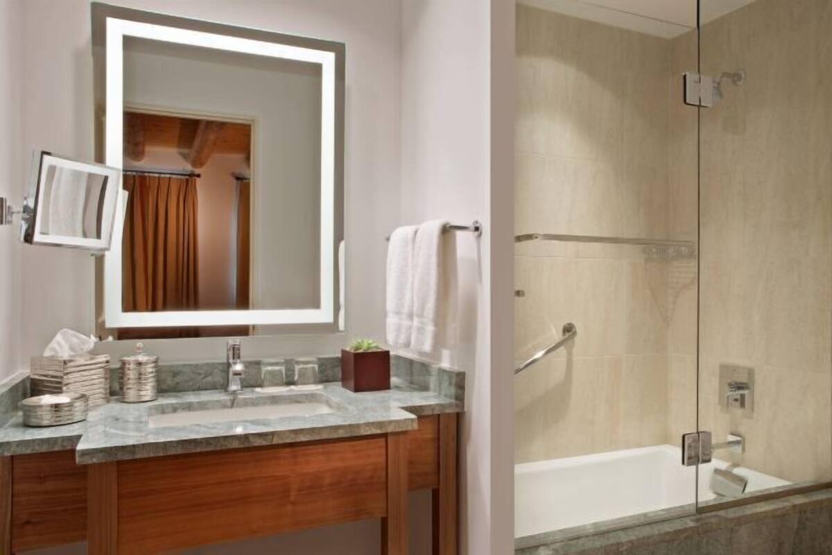 Combined shower/tub, designer toiletries, hair dryer, bathrobes