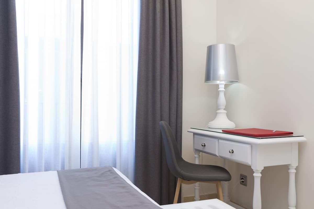 Standard Single Room, 1 Double Bed | In-room safe, individually decorated, desk, blackout drapes