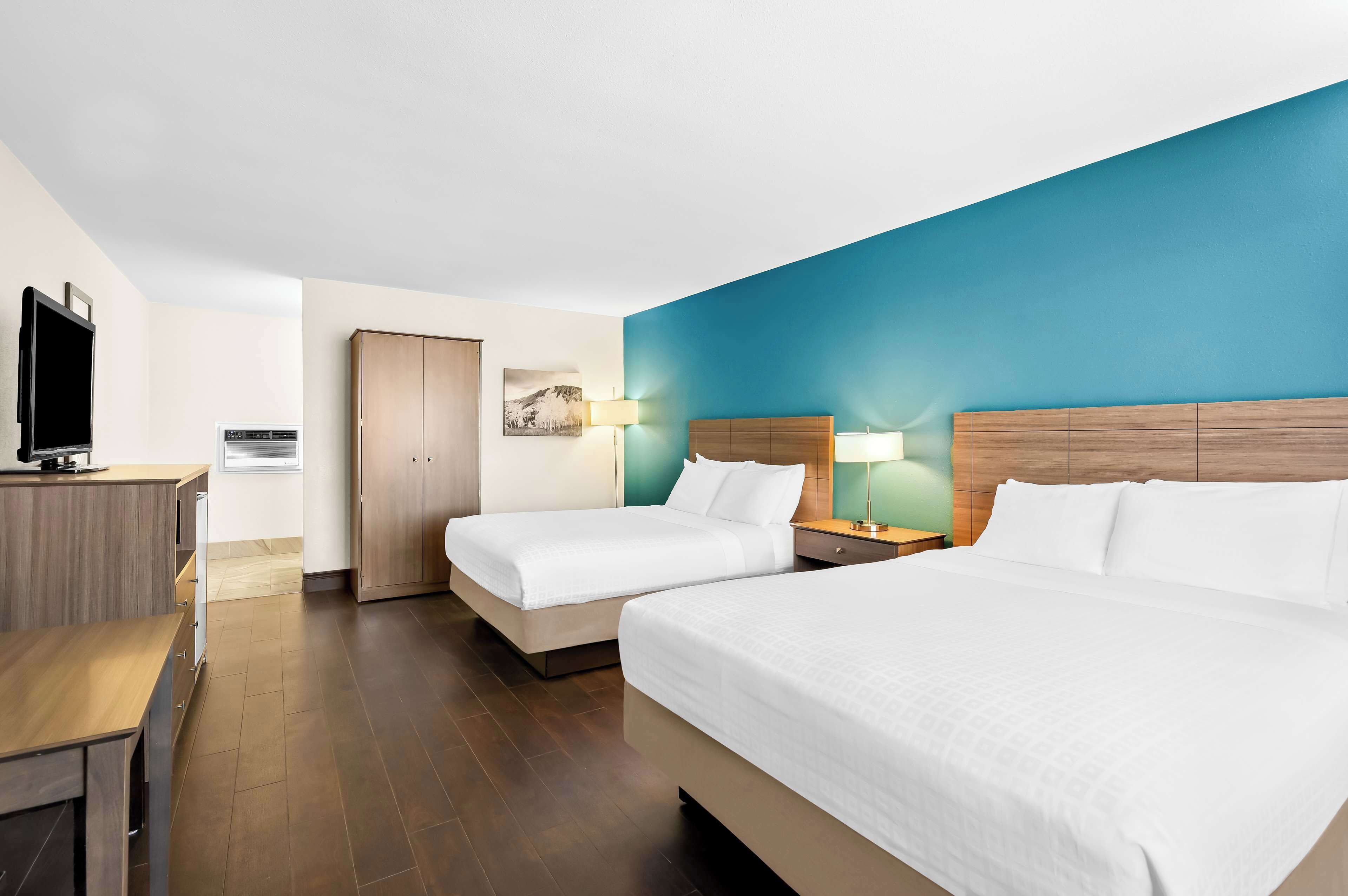 Standard Room, 2 Queen Beds, Non Smoking, Refrigerator &amp; Microwave (Pet Friendly) | Desk, blackout drapes, iron/ironing board, free cribs/infant beds