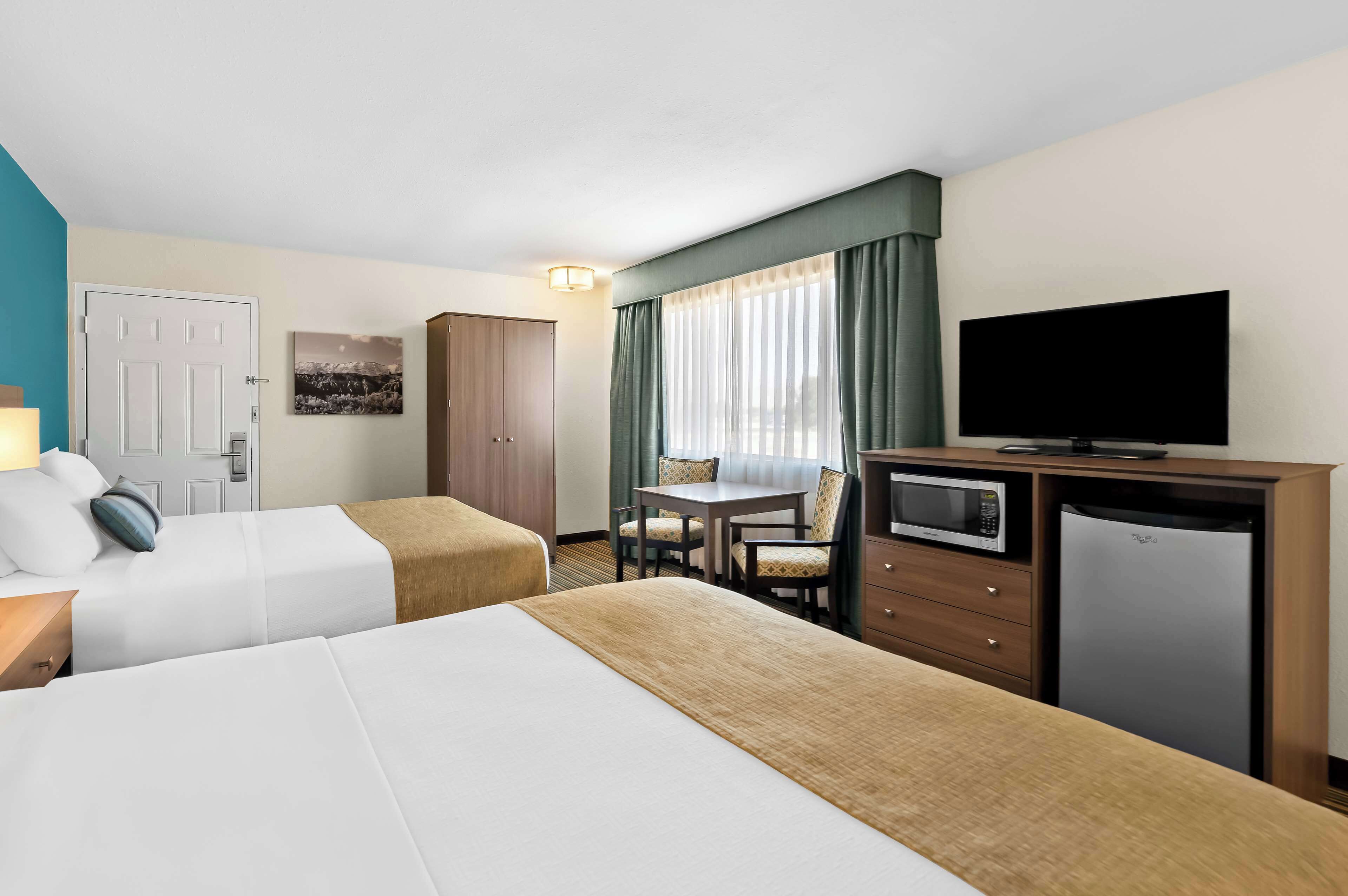 desk, blackout curtains, iron/ironing board, free cots/infant beds