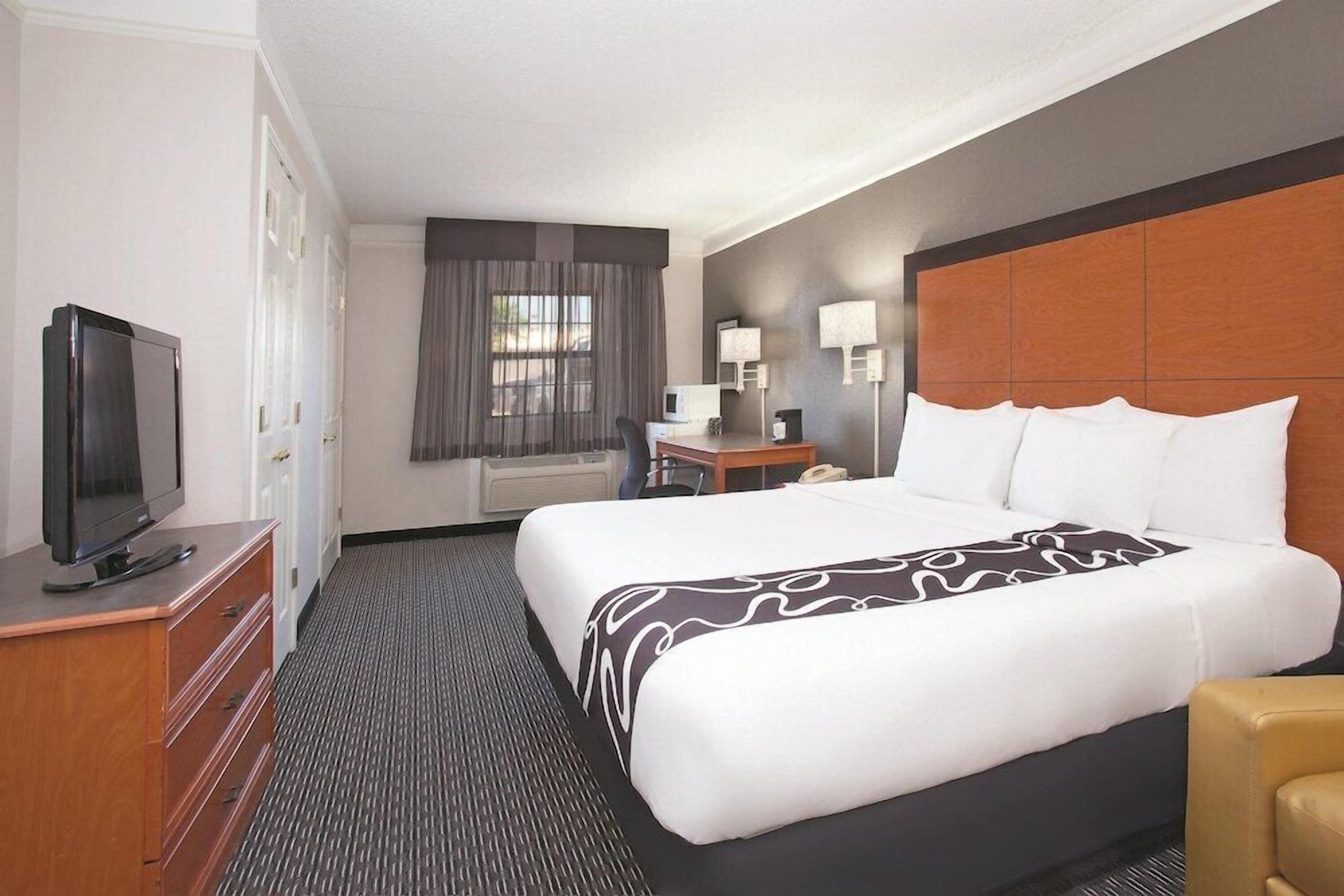 Premium bedding, desk, blackout drapes, iron/ironing board