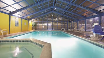 Indoor pool, open 9:00 AM to 11:00 PM, pool loungers