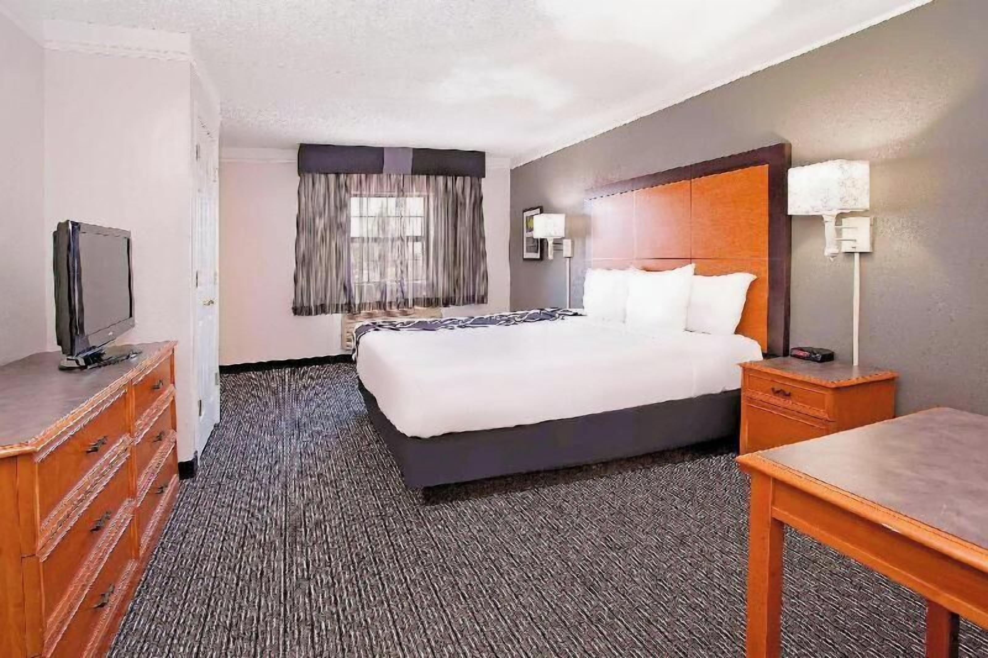 Premium bedding, desk, blackout drapes, iron/ironing board