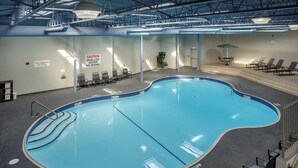 An indoor swimming pool with clear signage, including a caution for shallow water and a lifeguard absence notice. - Fairfield Inn & Suites by Marriott Belleville (Belleville)