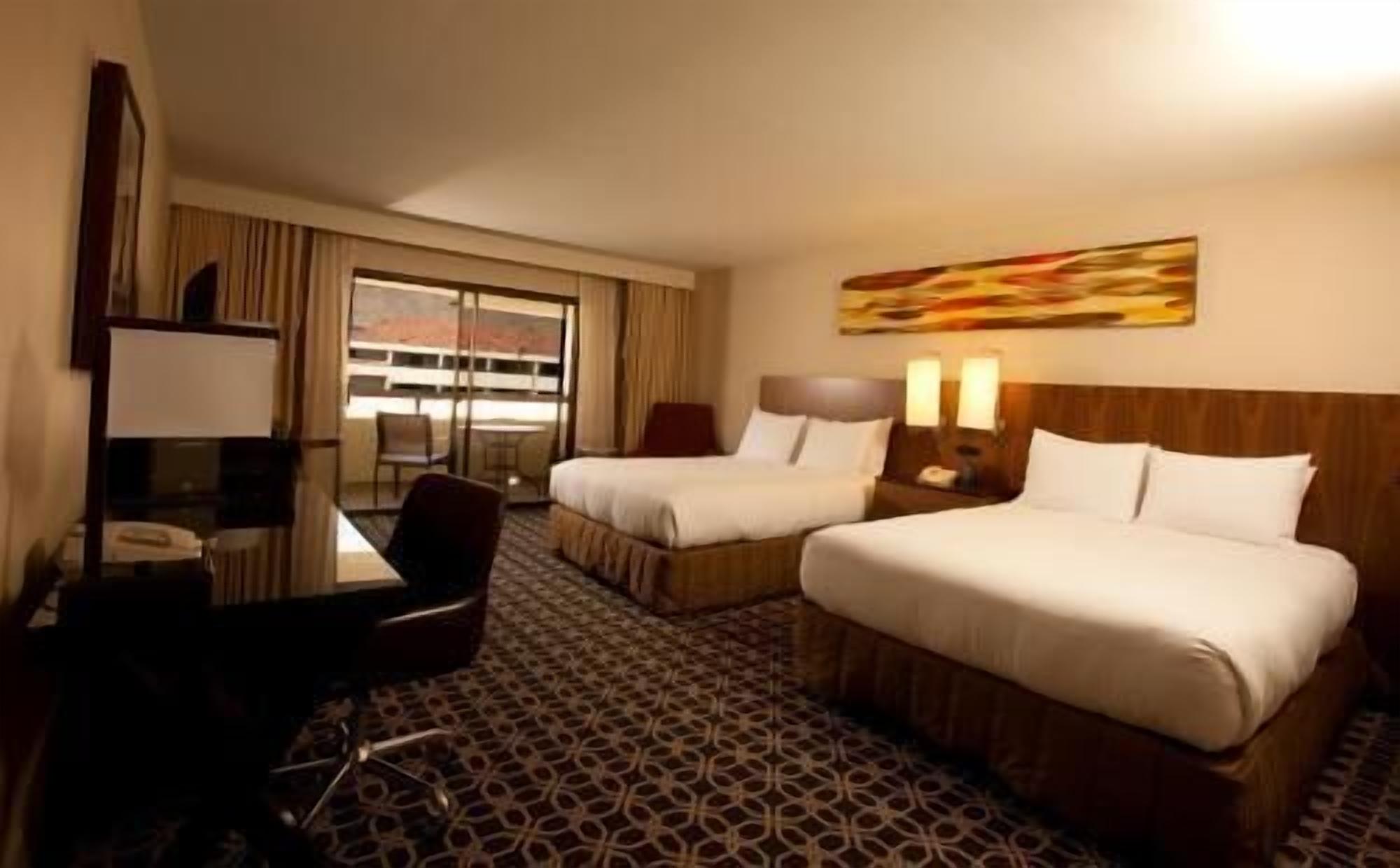 Premium bedding, down duvets, pillow-top beds, in-room safe