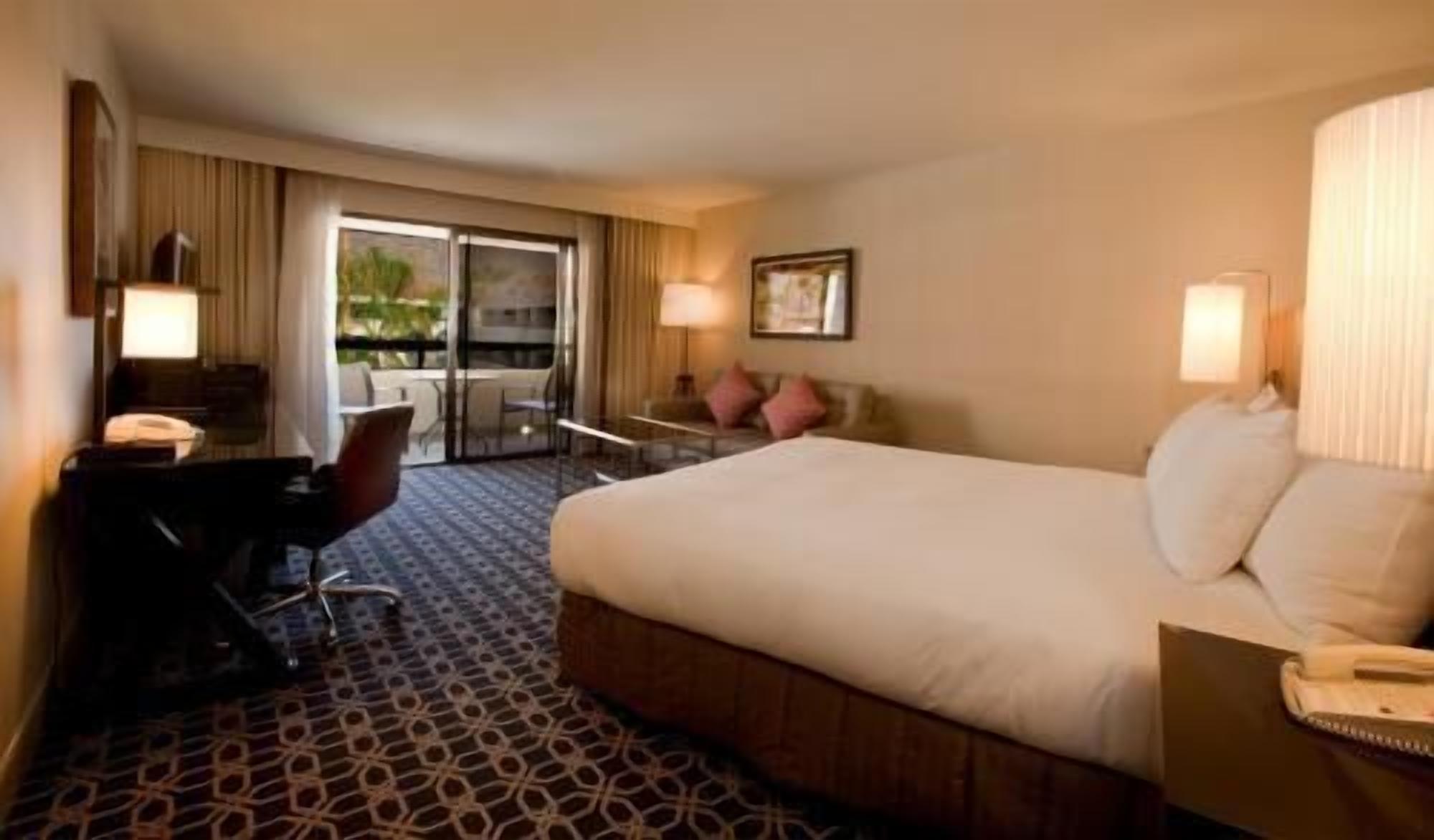 Premium bedding, down duvets, pillow-top beds, in-room safe