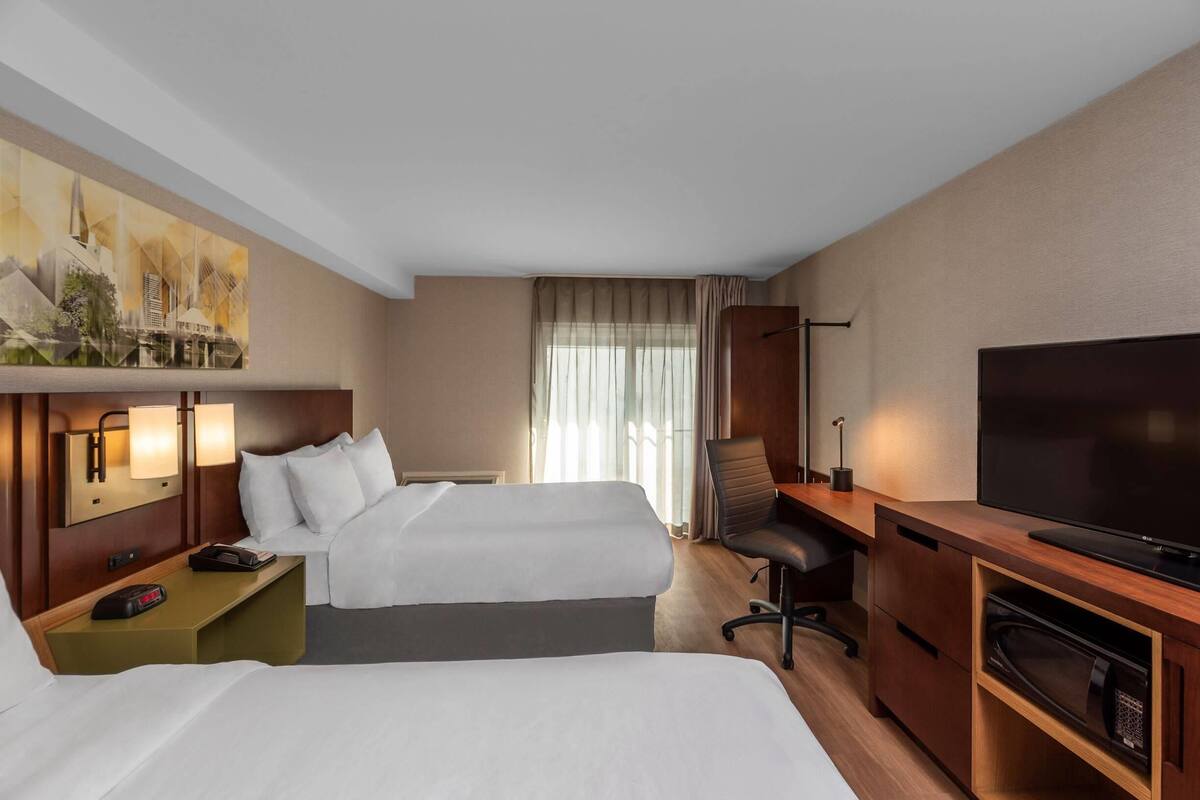 Pillowtop beds, desk, blackout drapes, iron/ironing board
