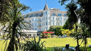 A hotel with a large, white building featuring multiple balconies and a prominent tower. - Royal Bath Hotel (Bournemouth)