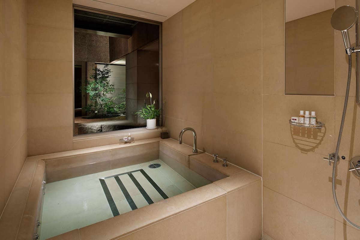 suite (ambassador) | bathroom | combined shower/bathtub, deep-soaking bathtub, rainfall showerhead