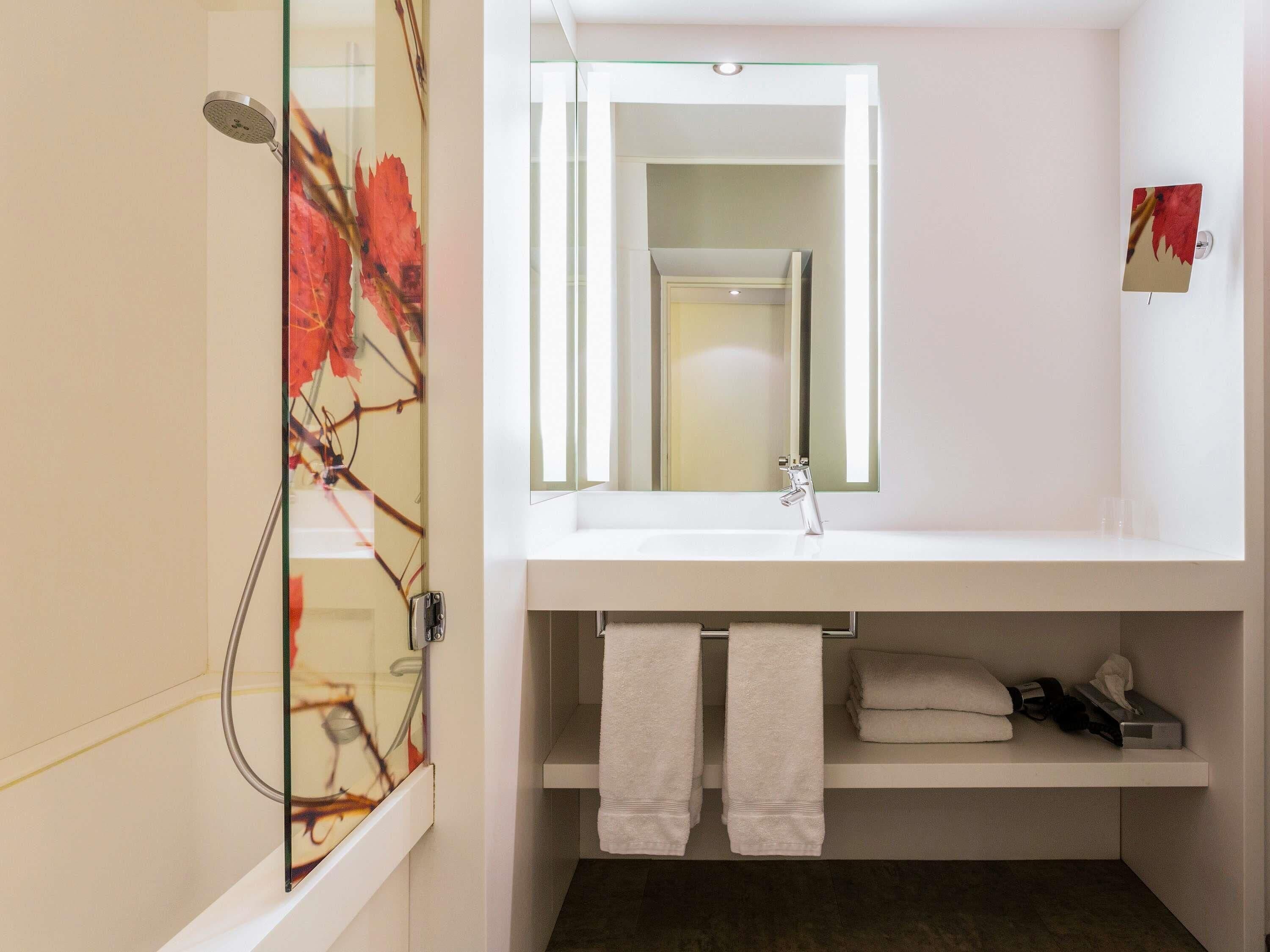 Shower, eco-friendly toiletries, hair dryer, towels