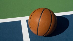 A basketball on a court with green and blue surfaces. - Doubletree by Hilton Somerset Hotel and Conference Center (Somerset)