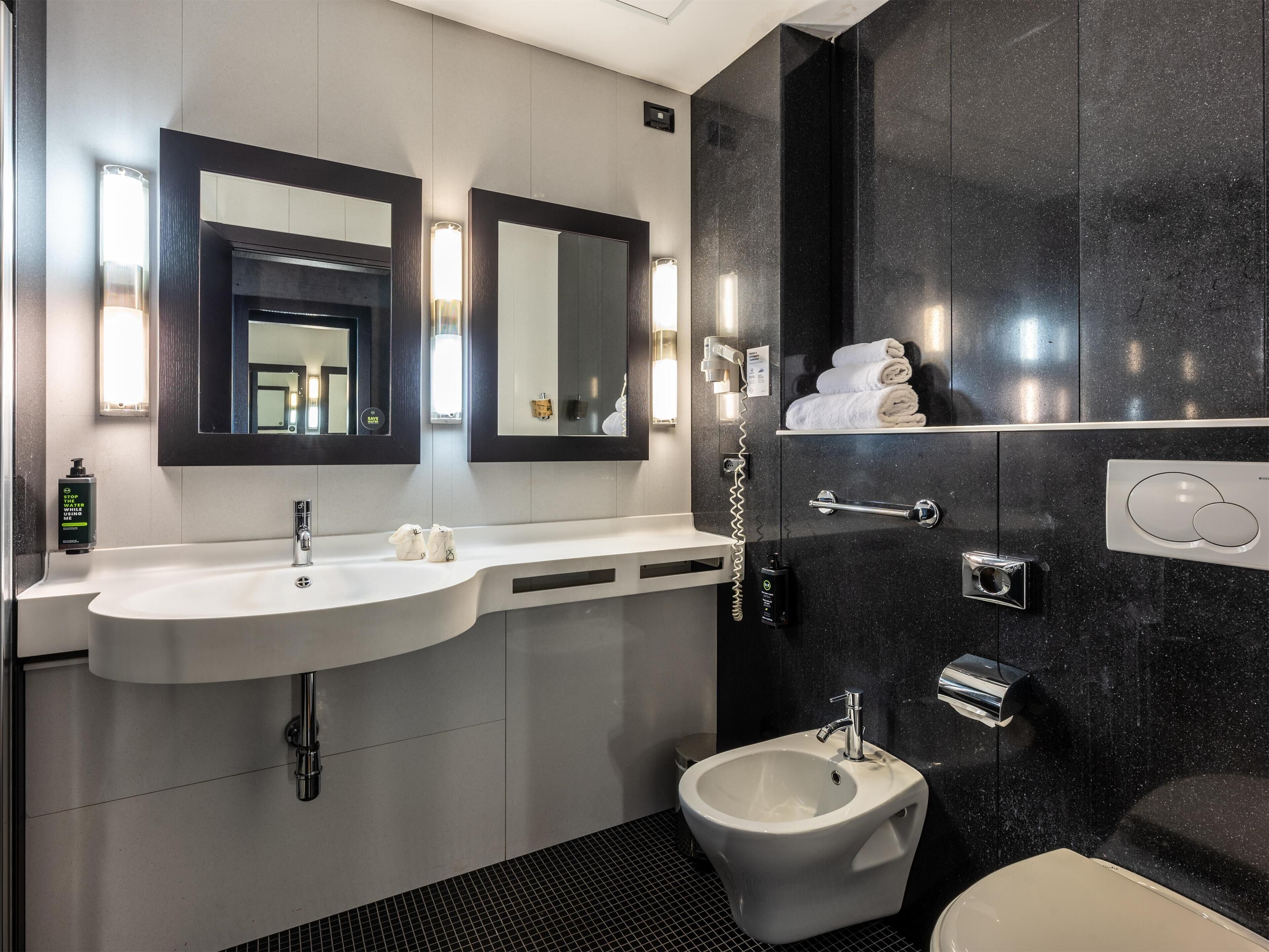superior suite | bathroom | rainfall showerhead, free toiletries, hair dryer, bidet