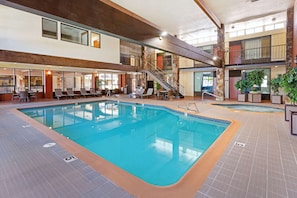 Indoor pool, open 9:00 AM to 11:00 PM, pool loungers