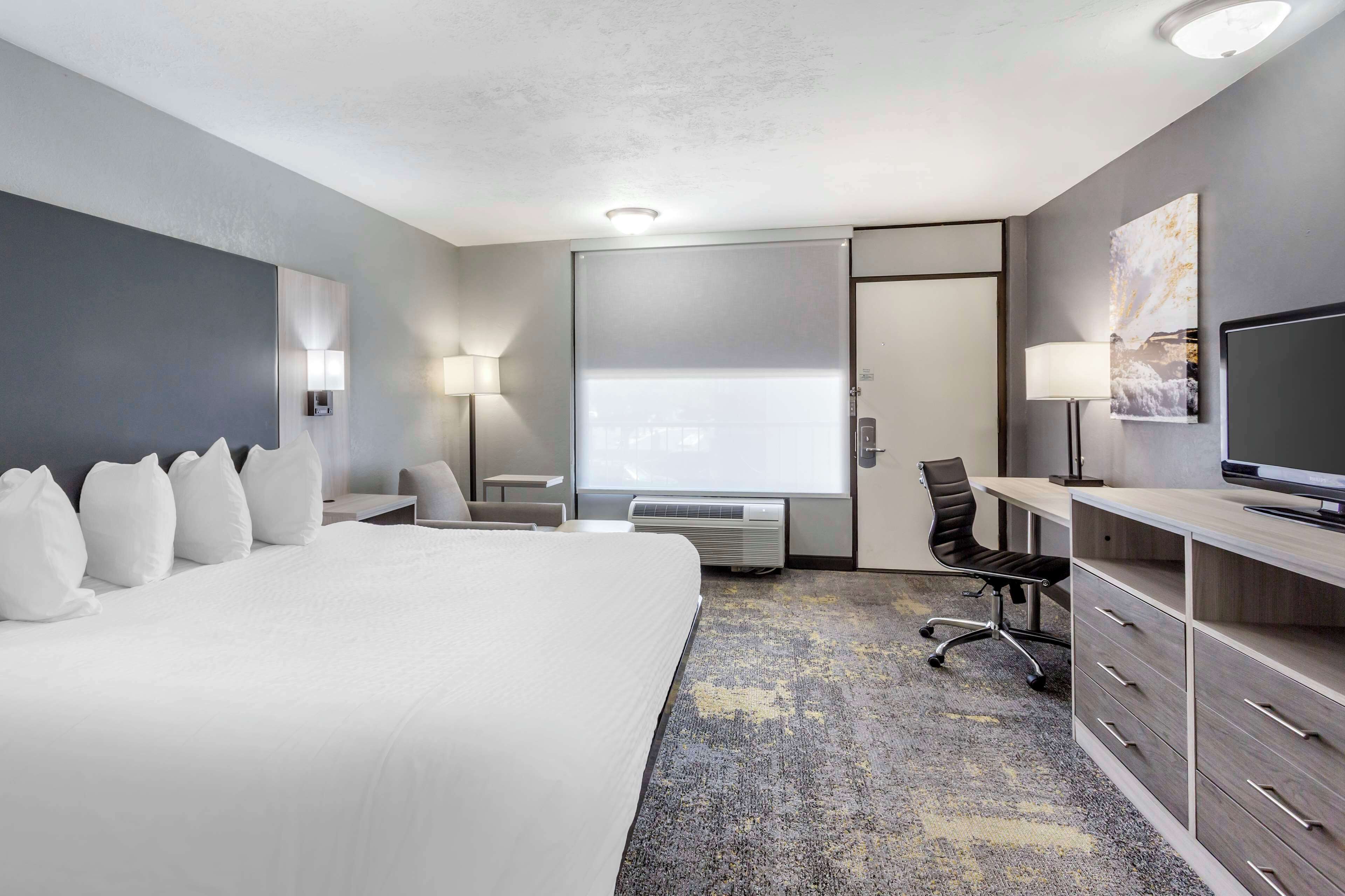 desk, laptop workspace, blackout curtains, iron/ironing board