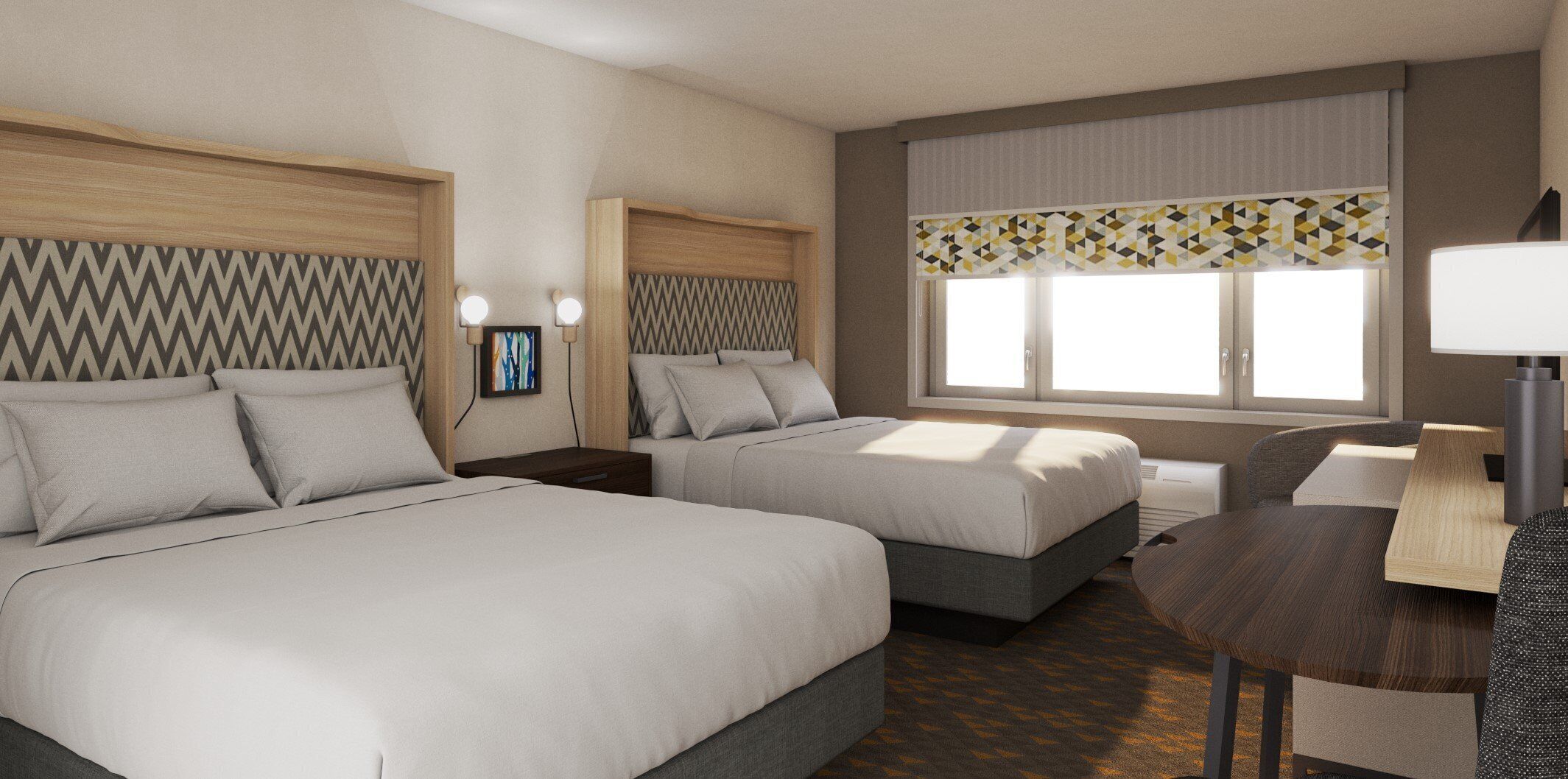 A hotel room with two beds, a desk, and a window with curtains.