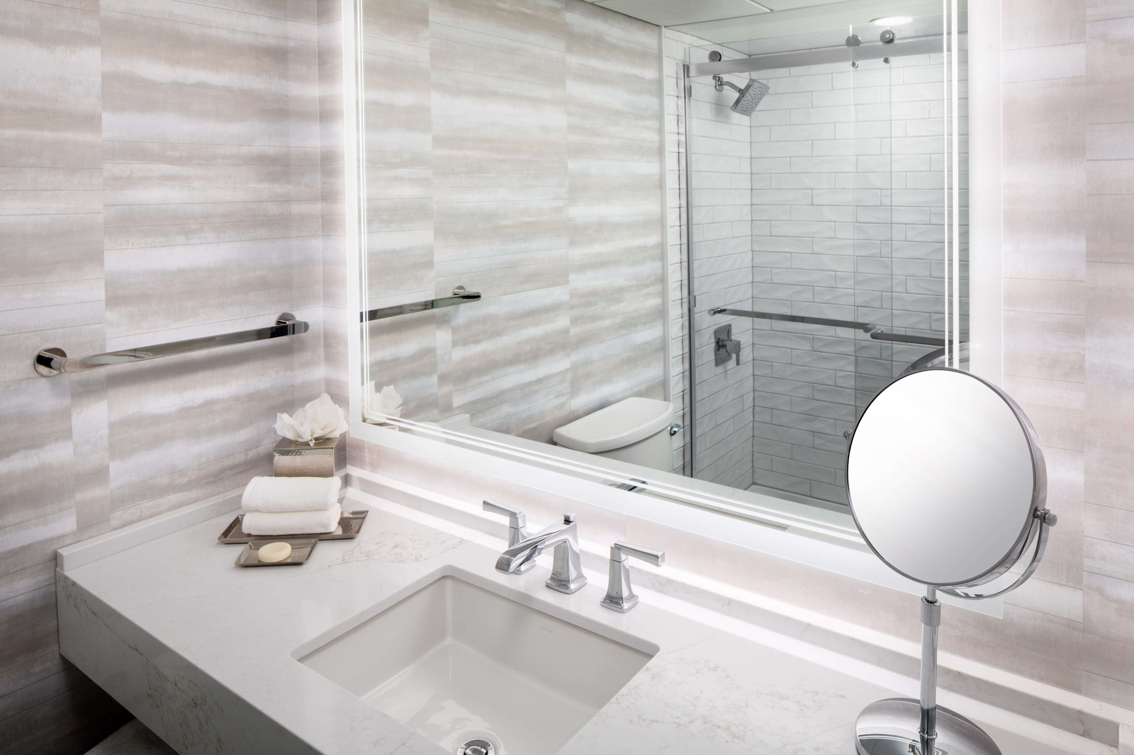 hydromassage showerhead, eco-friendly toiletries, hair dryer, towels