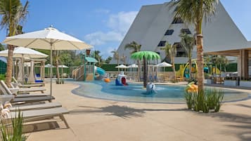 Relax by the pool with lounge chairs and umbrellas, or enjoy the water play area with slides and features.