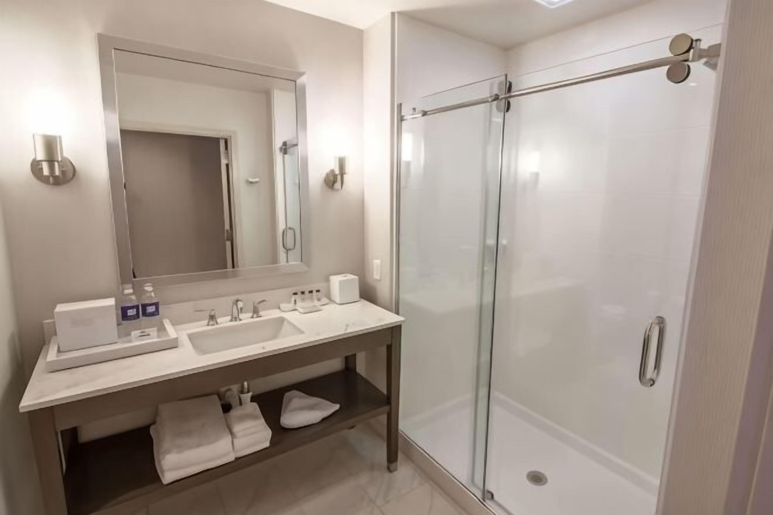 Shower, designer toiletries, hair dryer, bathrobes