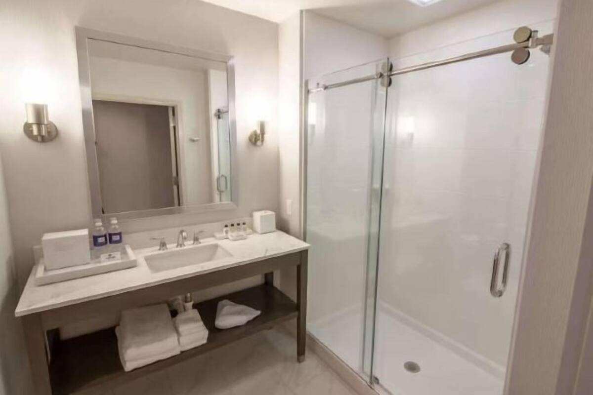 Shower, designer toiletries, hair dryer, bathrobes