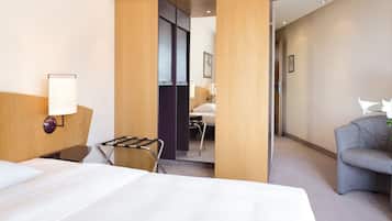 Hypo-allergenic bedding, desk, laptop workspace, blackout curtains
