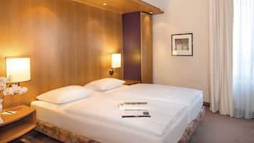 Hypo-allergenic bedding, desk, laptop workspace, blackout curtains