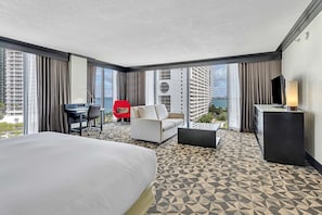 Junior Suite, 1 King Bed | Living area | 40-inch LCD TV with cable channels, TV, iPod dock