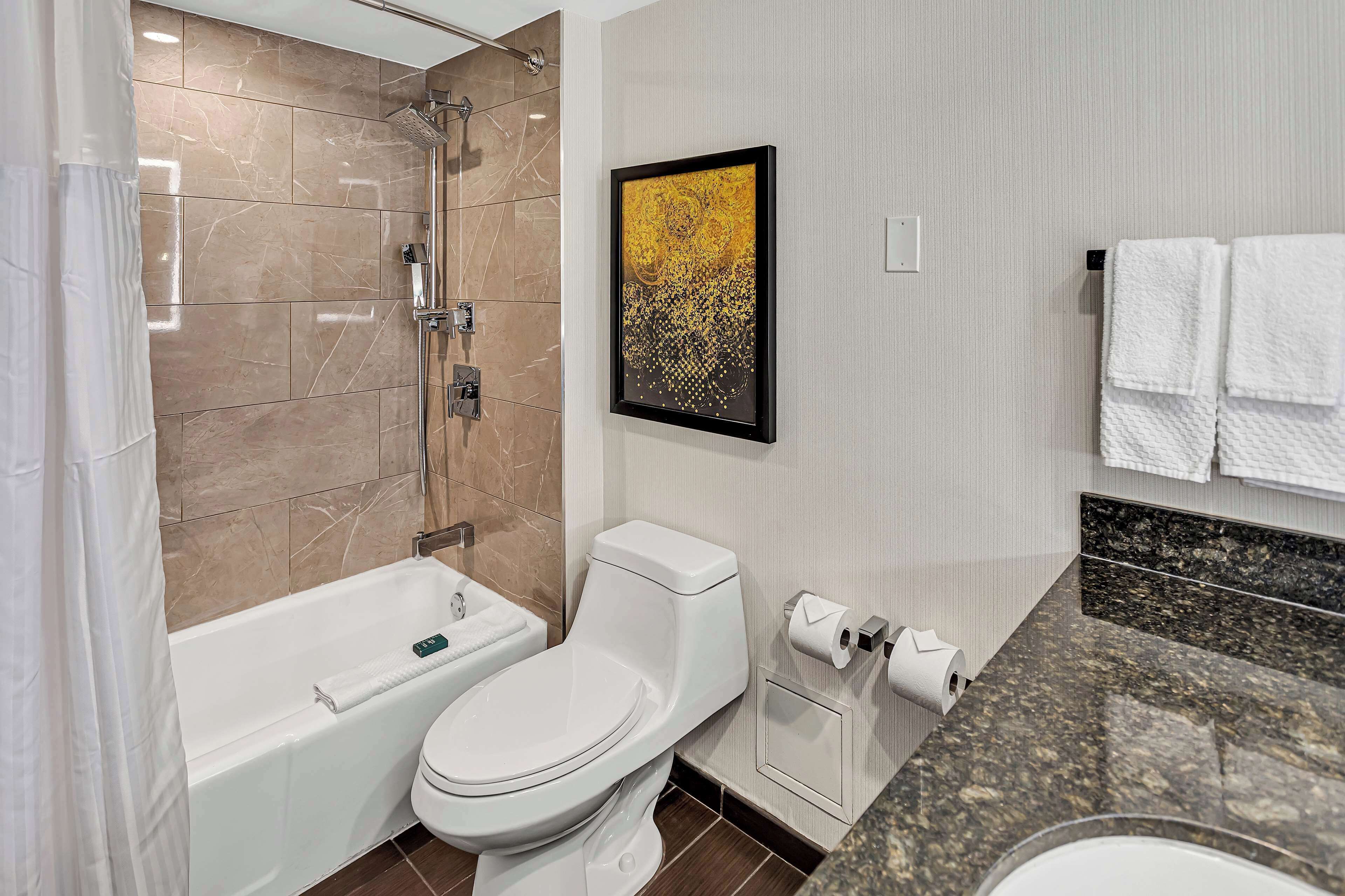 combined shower/bathtub, eco-friendly toiletries, hair dryer, towels