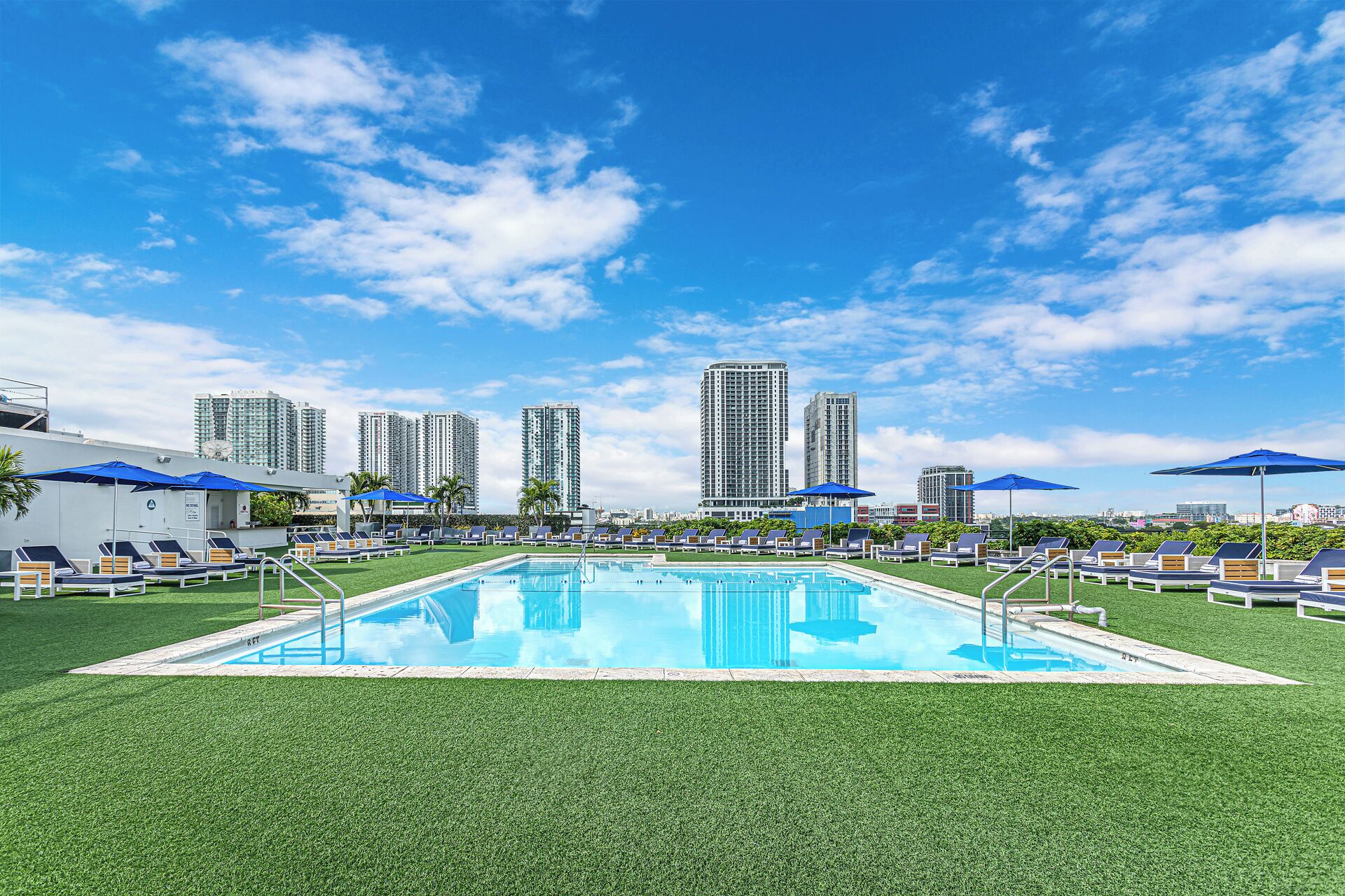 outdoor pool, open 8:00 am to 7:00 pm, pool loungers