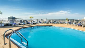 Seasonal outdoor pool, open 9:00 AM to 9:00 PM, pool loungers