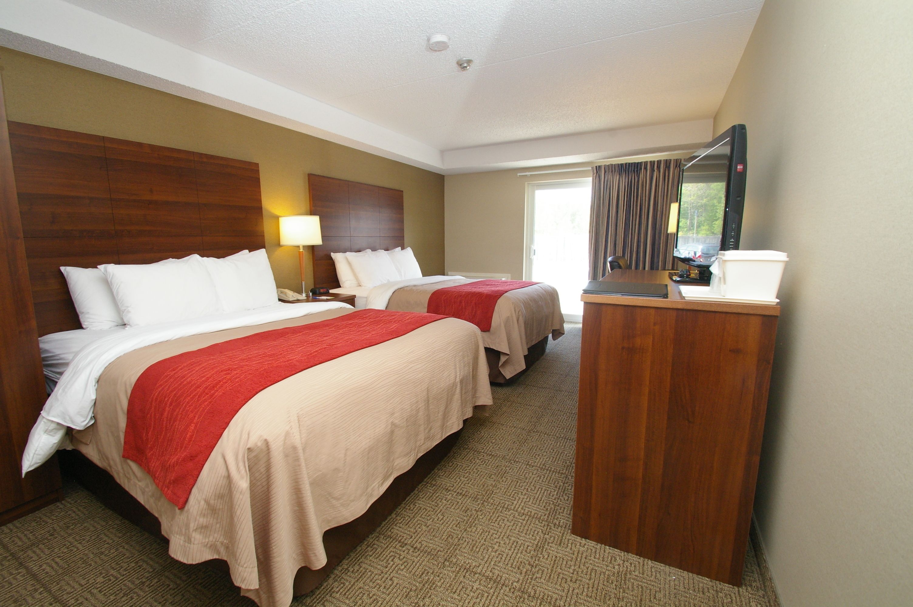 premium bedding, pillow-top beds, desk, laptop workspace